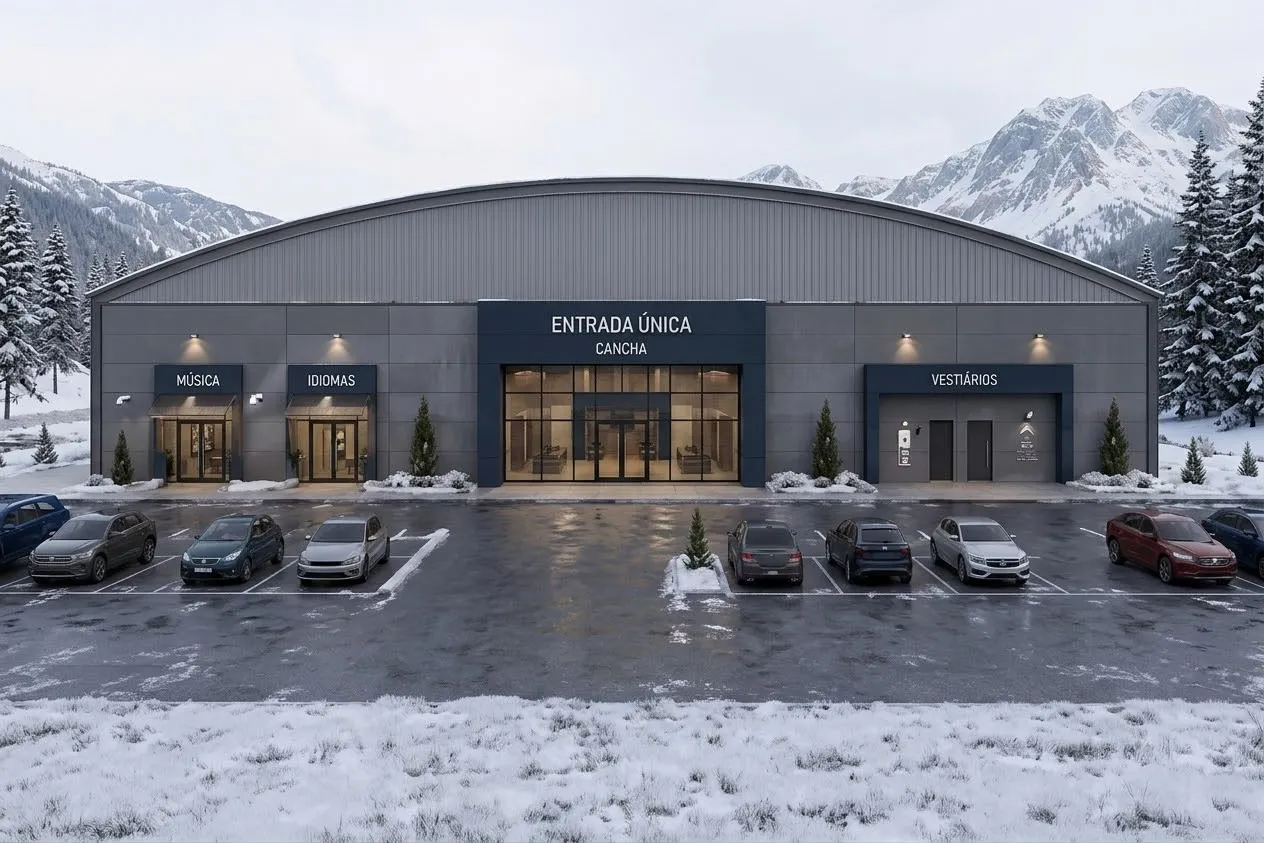 Exterior view of the centre's facade, with signed entrances for music, languages, the pitch and the changing rooms, surrounded by snowy mountains